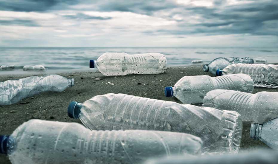 Plastic bottles litter beach. Plastic bottles litter beach.
