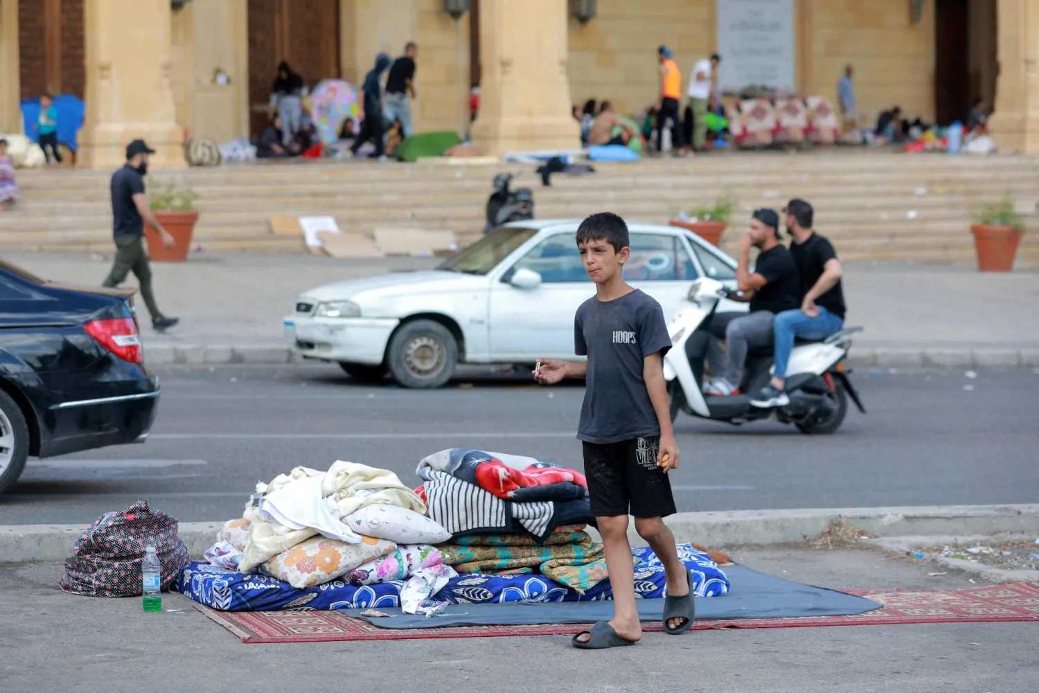 Internally displaced people are pictured in downtown Beirut on October 2, 2024. (Photo by IBRAHIM AMRO / AFP)