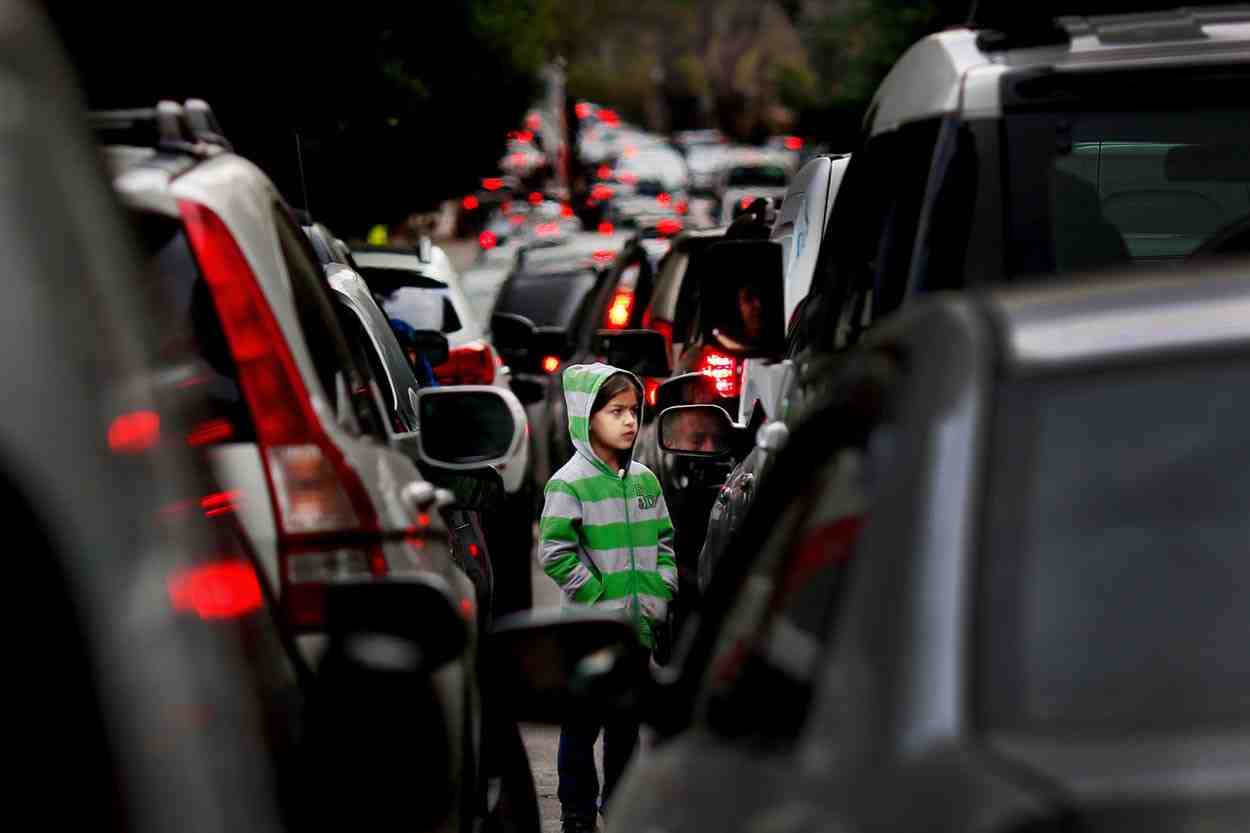 Photo credit: The Jakarta Post / File – A Syrian refugee girl begs for money in traffic in Beirut, Lebanon, February 10, 2016.