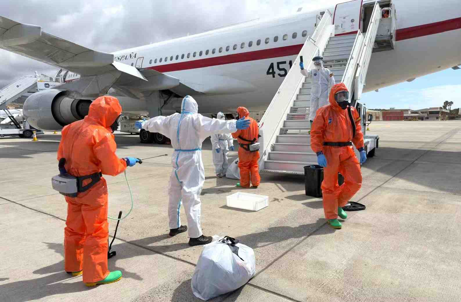 A Spanish passenger is sprayed with disinfectant by Spanish government officials before boarding a plane after disembarking from the hantavirus-stricken cruise ship MV Hondius at Tenerife airport in the Canary Islands, Spain, Sunday, May 10, 2026. Associated Press