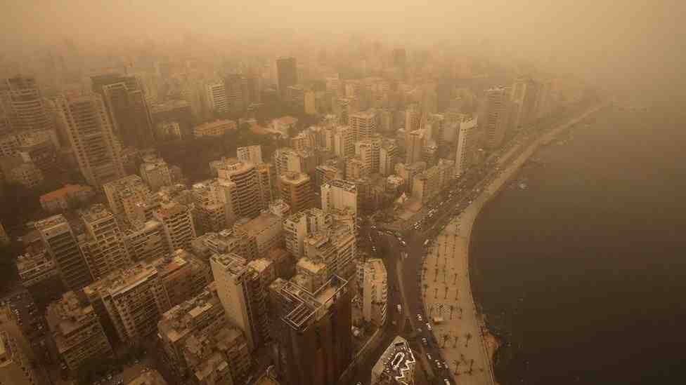 Dust and sand storms affect visibility over a city
