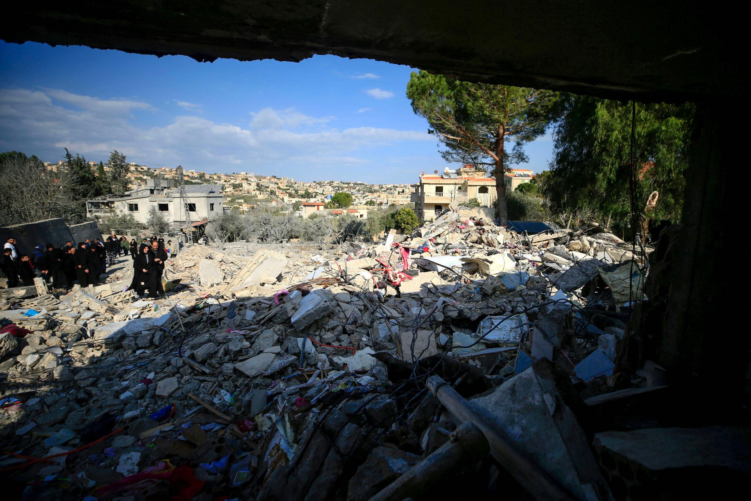 People check the rubble of a building in Bint Jbeil in southern Lebanon, on December 27, 2023. (Photo by AFP) People check the rubble of a building in Bint Jbeil in southern Lebanon, on December 27, 2023. (Photo by AFP)