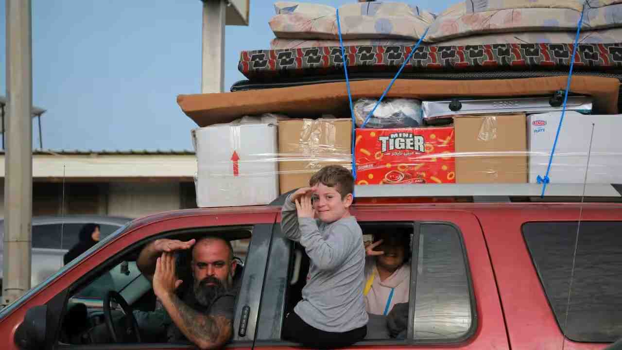 Displaced residents journeyed back to their homes in the southern Lebanon on Friday after a ceasefire took effect overnight. Source: AFP / Ibrahim Amro