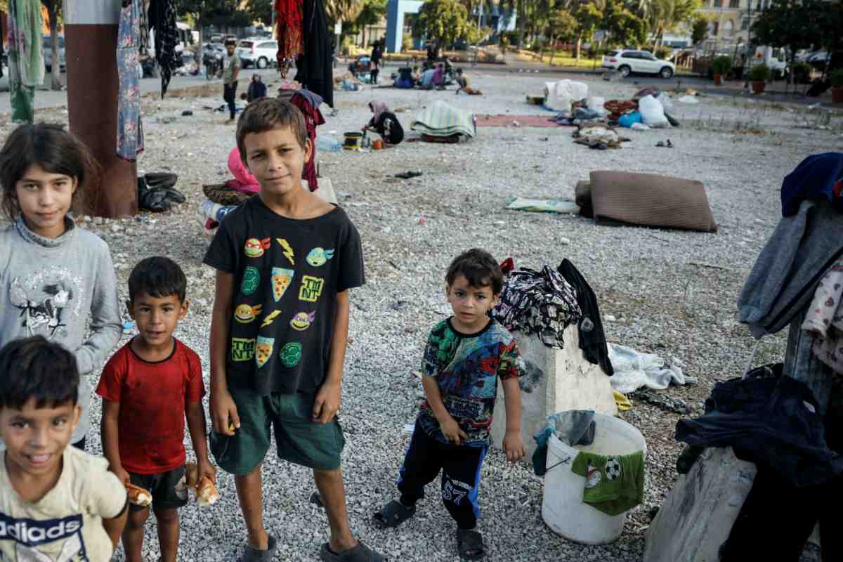 Displaced children pose at a gravel lot, where their families took temporary shelter in Beirut, Lebanon, on 8th October, 2024. PICTURE: Reuters/Louisa Gouliamaki/File photo