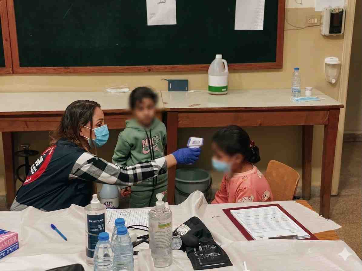 A child receiving a medical check up in Saida.