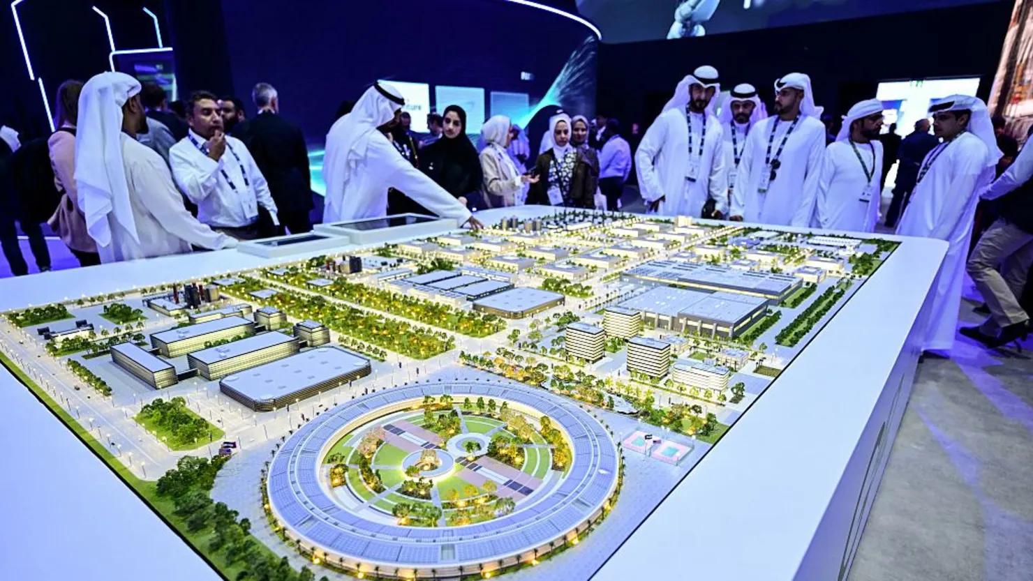 Guests look at a model of the largest data center in the UAE under construction in Abu Dhabi. (Image Credit: AFP) Guests look at a model of the largest data center in the UAE under construction in Abu Dhabi. (Image Credit: AFP)