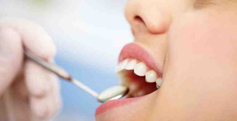 A close-up shot of a patient receiving a dental examination