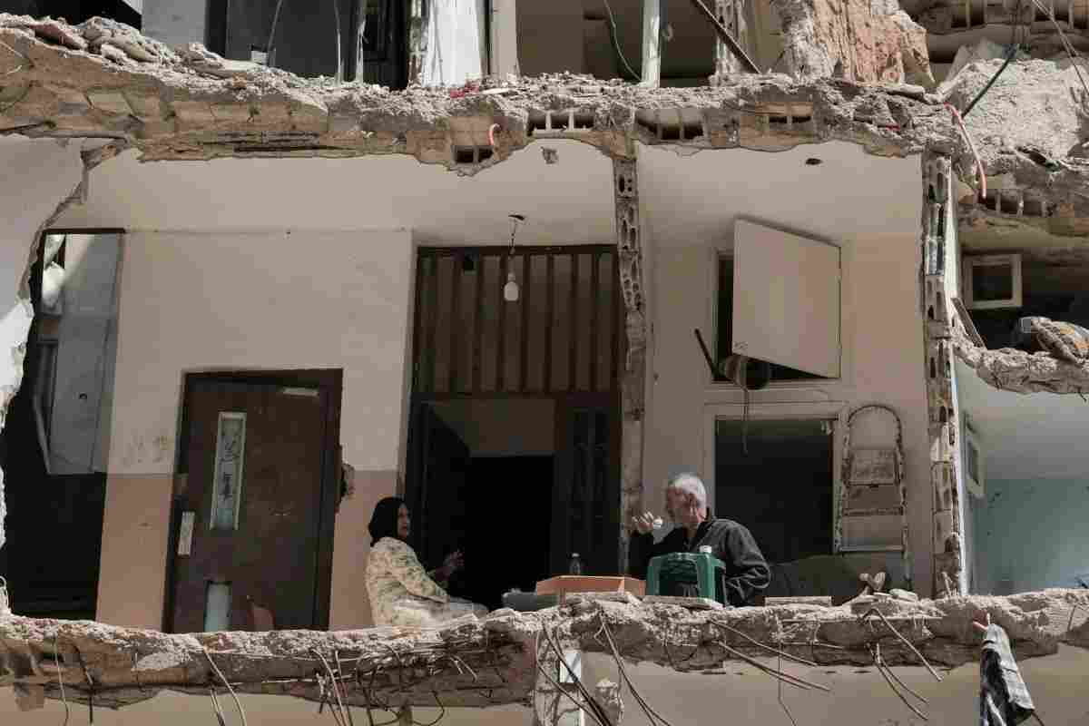 Ali Soueidane, 60 years old, originally from South Lebanon, has coffee with his wife in their house damaged by an Israeli bombardment. Photo Raghed Waked/Reuters