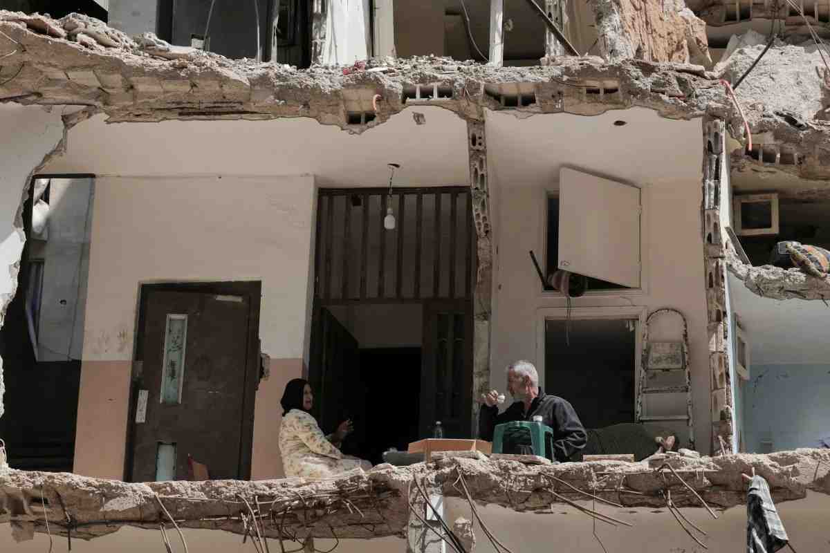 Ali Soueidane, 60 years old, originally from South Lebanon, has coffee with his wife in their house damaged by an Israeli bombardment. Photo Raghed Waked/Reuters